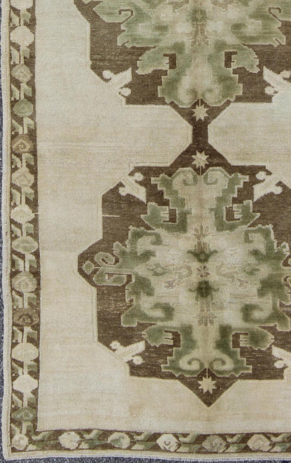 Green Turkish Oushak Runner This lovely Oushak runner displays three elegant medallions of multi - green colors on a solid cream field. The variety of green colors includes olive green, crocodile green and seaweed green. The minimal border coordin... - Keivan Woven ArtsTU - ISA - 3362 - 5740Rug