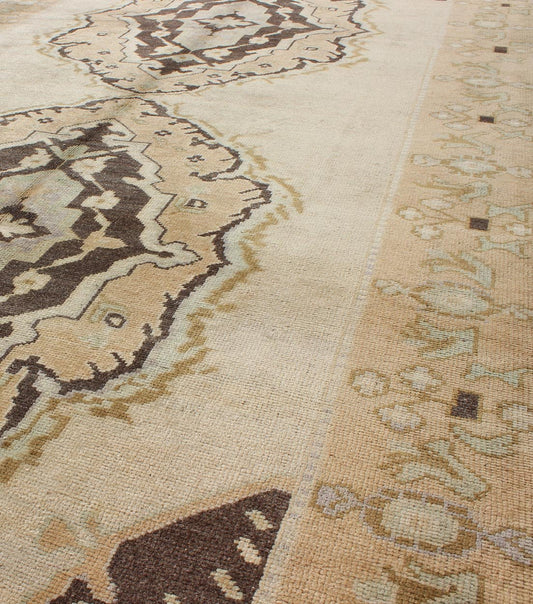 Vintage Turkish Oushak Gallery Rug with Two Medallions in Taupe, Brown and Cream Measures: 4'11 x 10'4. This beautiful vintage Oushak gallery rug from mid - 20th century Turkey features a Classic Oushak design. The faint sand ground is ho... - Keivan Woven ArtsTU - ISA - 3363 - 5744Rug