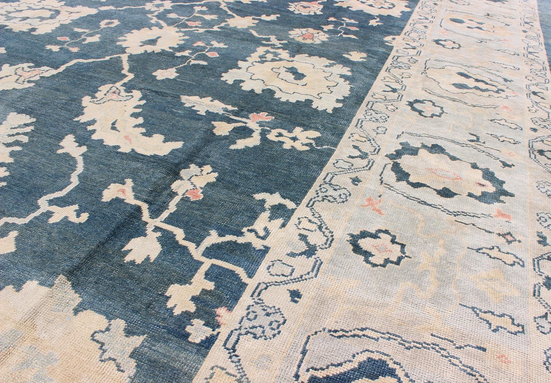 Large Turkish Oushak Rug with Dark Teal Blue Background & Ice Blue Border. Turkish large Oushak rug with large flower design in Teal Blue , ice blue/ gray and accent colors of coral and butter. Turkish Oushak all - over floral design, rug TU... - Keivan Woven ArtsTU - MSD - 43 - 6833Rug