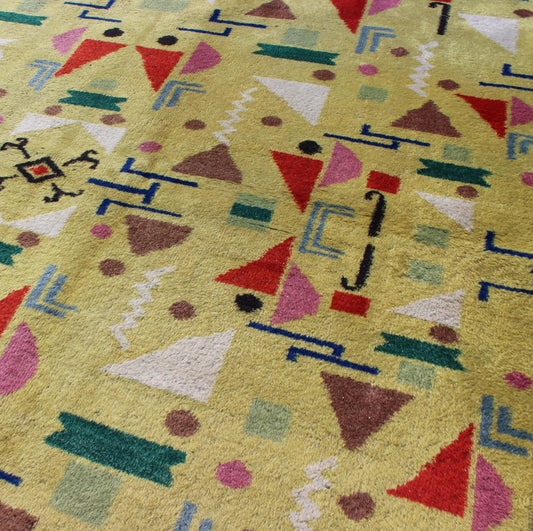 Mid Century Modern Vintage Turkish Rug in Yellow Background and Multi - Colors Measures: 4' x 7'10. Rendered in a yellow background with a spotted and speckled assortment of yellow, red, black, green and blue colors, this very unique Mid - Century r... - Keivan Woven ArtsTU - MTU - 05 - 5319Rug