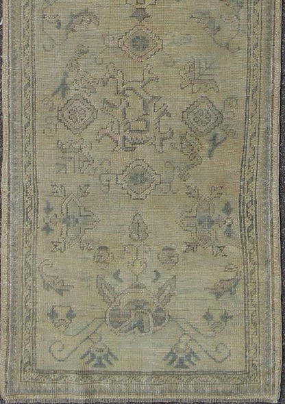 Antique Turkish Oushak Runner with All - Over Design with green and Blue Accents Measures: 2'10 x 12'8. This 1930's antique muted Oushak runner rests beautifully upon a field of elegant cream and taupe. An all - over pattern takes center sta... - Keivan Woven ArtsTU - MTU - 1002 - 8084Rug