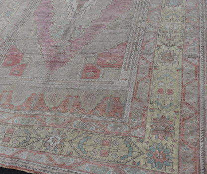 Vintage Turkish Oushak Rug with Layered Medallion Design Measures: 5'7 x 9'3 This vintage Turkish Oushak perfectly displays the craftsmanship of this time. The color palette is completely muted, with shades of taupe, camel, red, blue, te... - Keivan Woven ArtsTU - MTU - 110 - 18932Rug
