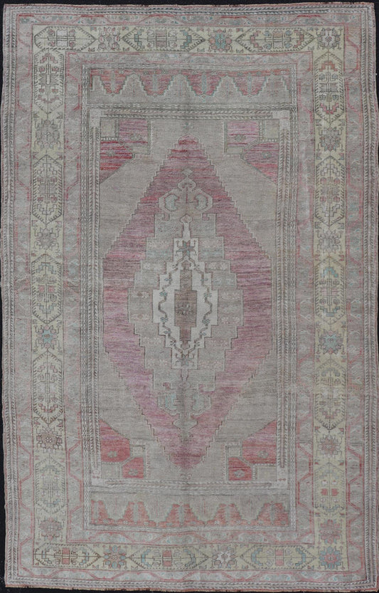 Vintage Turkish Oushak Rug with Layered Medallion Design Measures: 5'7 x 9'3 This vintage Turkish Oushak perfectly displays the craftsmanship of this time. The color palette is completely muted, with shades of taupe, camel, red, blue, te... - Keivan Woven ArtsTU - MTU - 110 - 18932Rug