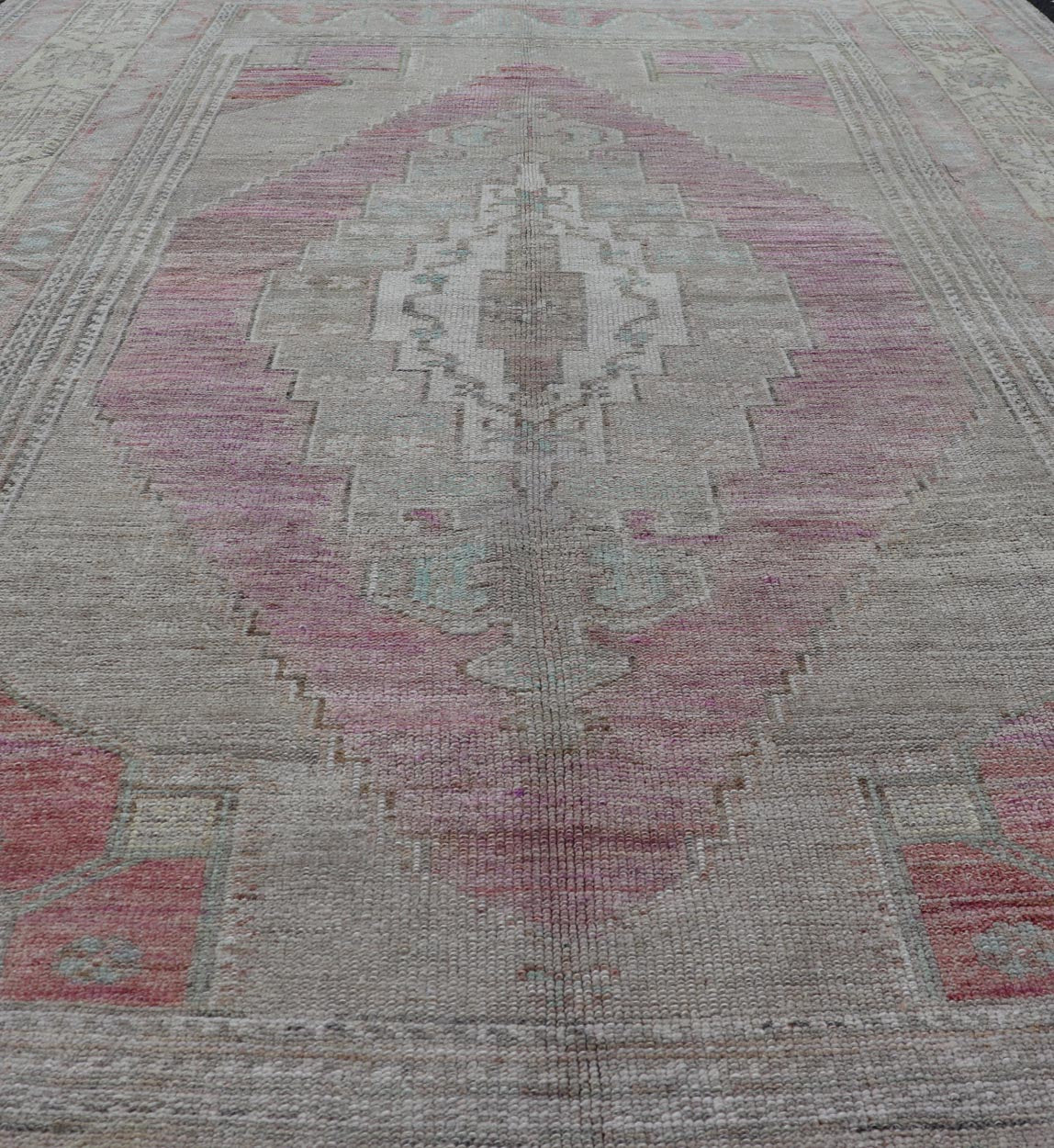 Vintage Turkish Oushak Rug with Layered Medallion Design Measures: 5'7 x 9'3 This vintage Turkish Oushak perfectly displays the craftsmanship of this time. The color palette is completely muted, with shades of taupe, camel, red, blue, te... - Keivan Woven ArtsTU - MTU - 110 - 18932Rug