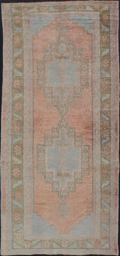 Vintage Turkish Oushak Gallery with Tribal Medallions in Soft Peach and Green Measures: 4'7 x 11'2 This vintage Turkish Oushak features large tribal medallions in light blue and tan. The medallions are decorated in tribal motifs and a p... - Keivan Woven ArtsTU - MTU - 117 - 18740Rug