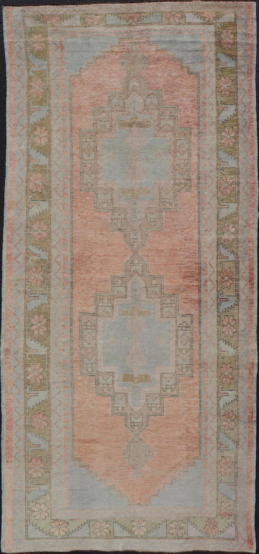 Vintage Turkish Oushak Gallery with Tribal Medallions in Soft Peach and Green Measures: 4'7 x 11'2 This vintage Turkish Oushak features large tribal medallions in light blue and tan. The medallions are decorated in tribal motifs and a p... - Keivan Woven ArtsTU - MTU - 117 - 18740Rug