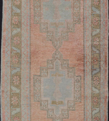Vintage Turkish Oushak Gallery with Tribal Medallions in Soft Peach and Green Measures: 4'7 x 11'2 This vintage Turkish Oushak features large tribal medallions in light blue and tan. The medallions are decorated in tribal motifs and a p... - Keivan Woven ArtsTU - MTU - 117 - 18740Rug