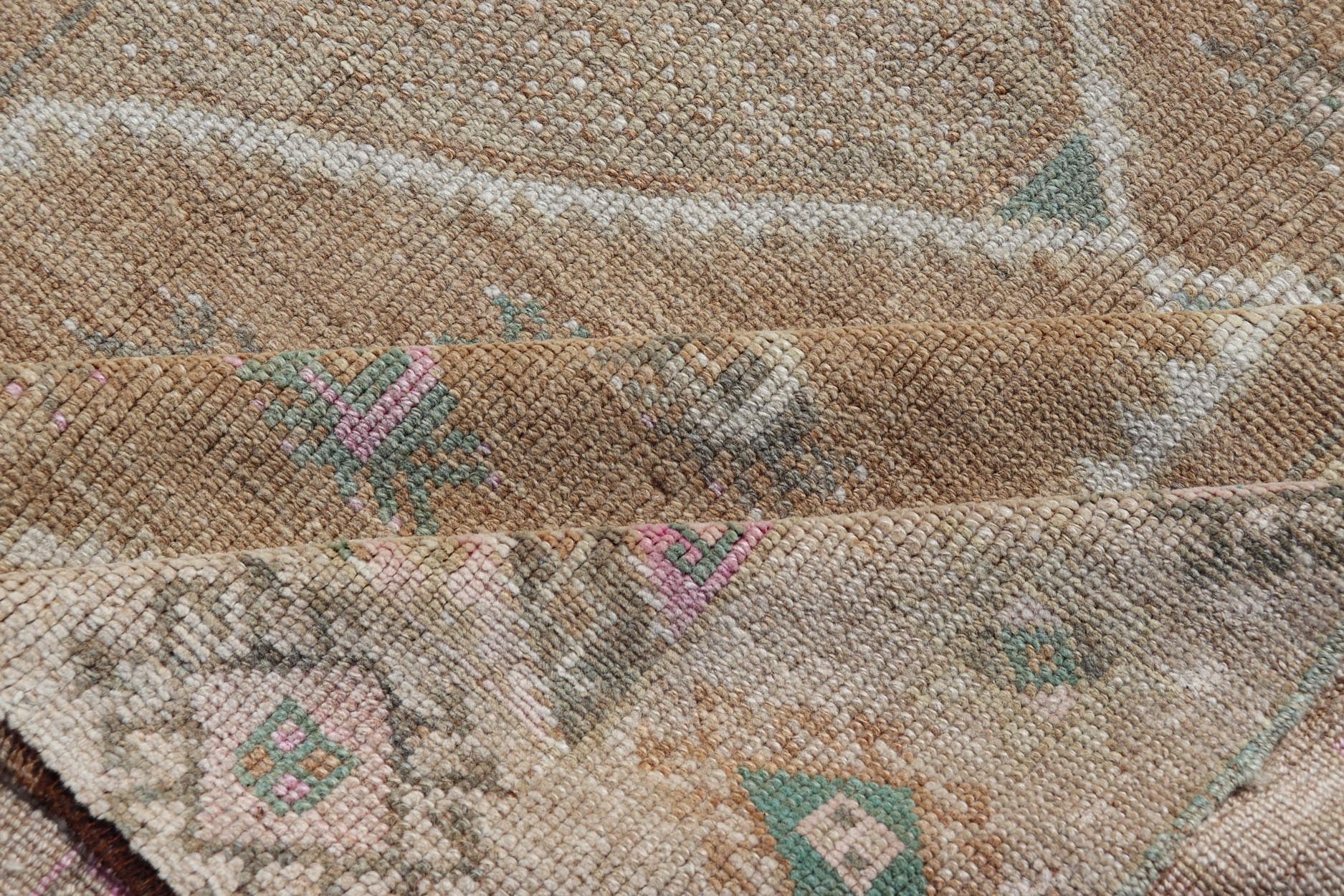 Unique & Colorful Turkish Kars Runner with Tribal Designs and Geometric Motifs Vintage Turkish runner in Brown background, accent colors, tan, green, light blue, taupe, Keivan Woven Arts / rug/TU - MTU - 121, country of origin / type: Turkey / Ousha... - Keivan Woven ArtsTU - MTU - 121 - 18938Rug