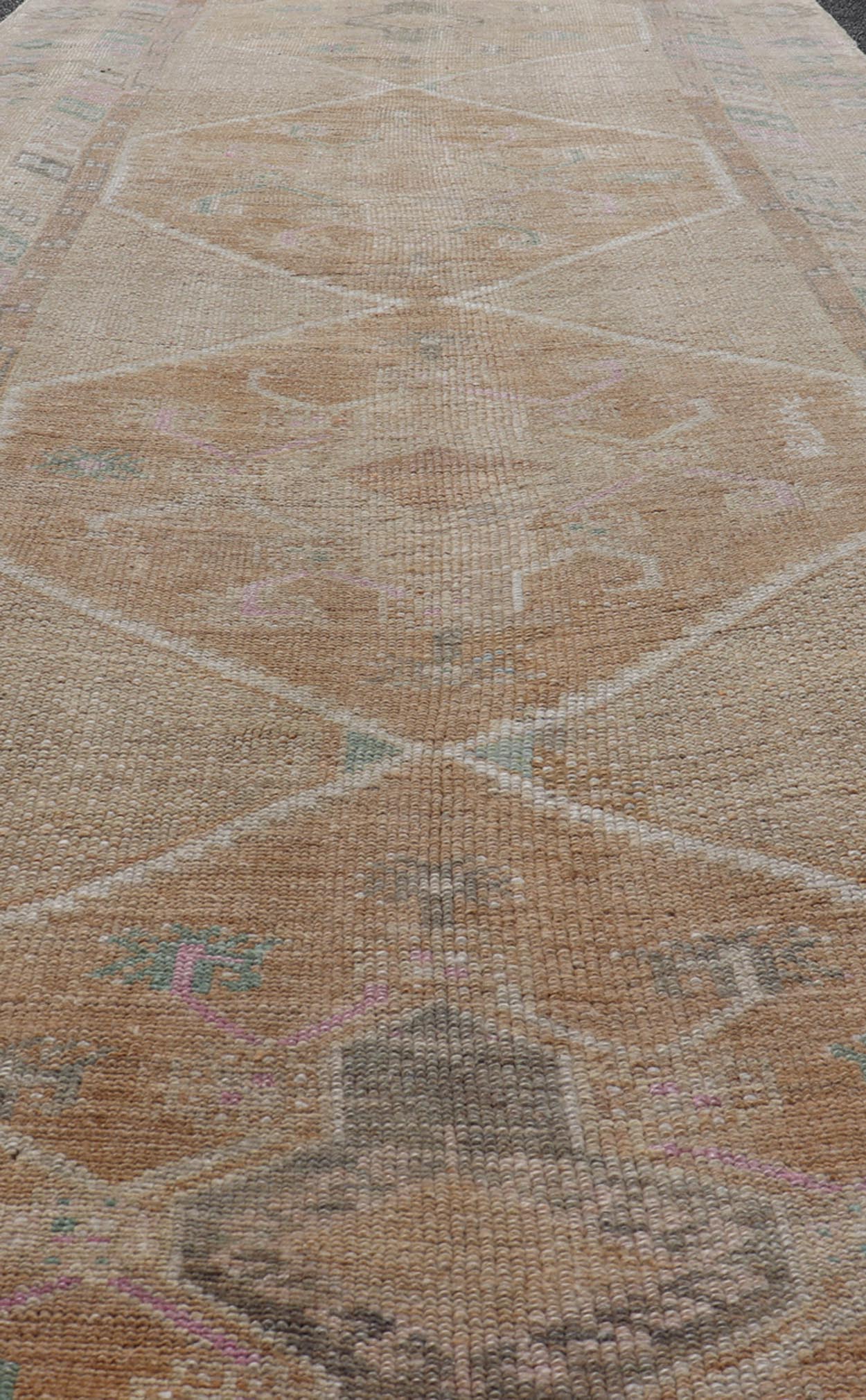 Unique & Colorful Turkish Kars Runner with Tribal Designs and Geometric Motifs Vintage Turkish runner in Brown background, accent colors, tan, green, light blue, taupe, Keivan Woven Arts / rug/TU - MTU - 121, country of origin / type: Turkey / Ousha... - Keivan Woven ArtsTU - MTU - 121 - 18938Rug