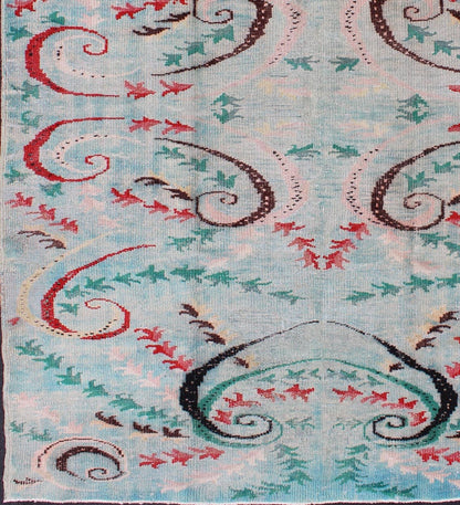 Mid - Century Modern Turkish Rug - This Mid - Century Modern rug is set on light blue background. The vine scroll motifs portray movement in this very unique rug. 6`3 x 9`1 - Keivan Woven ArtsTU - MTU - 136058 - 4706Rug