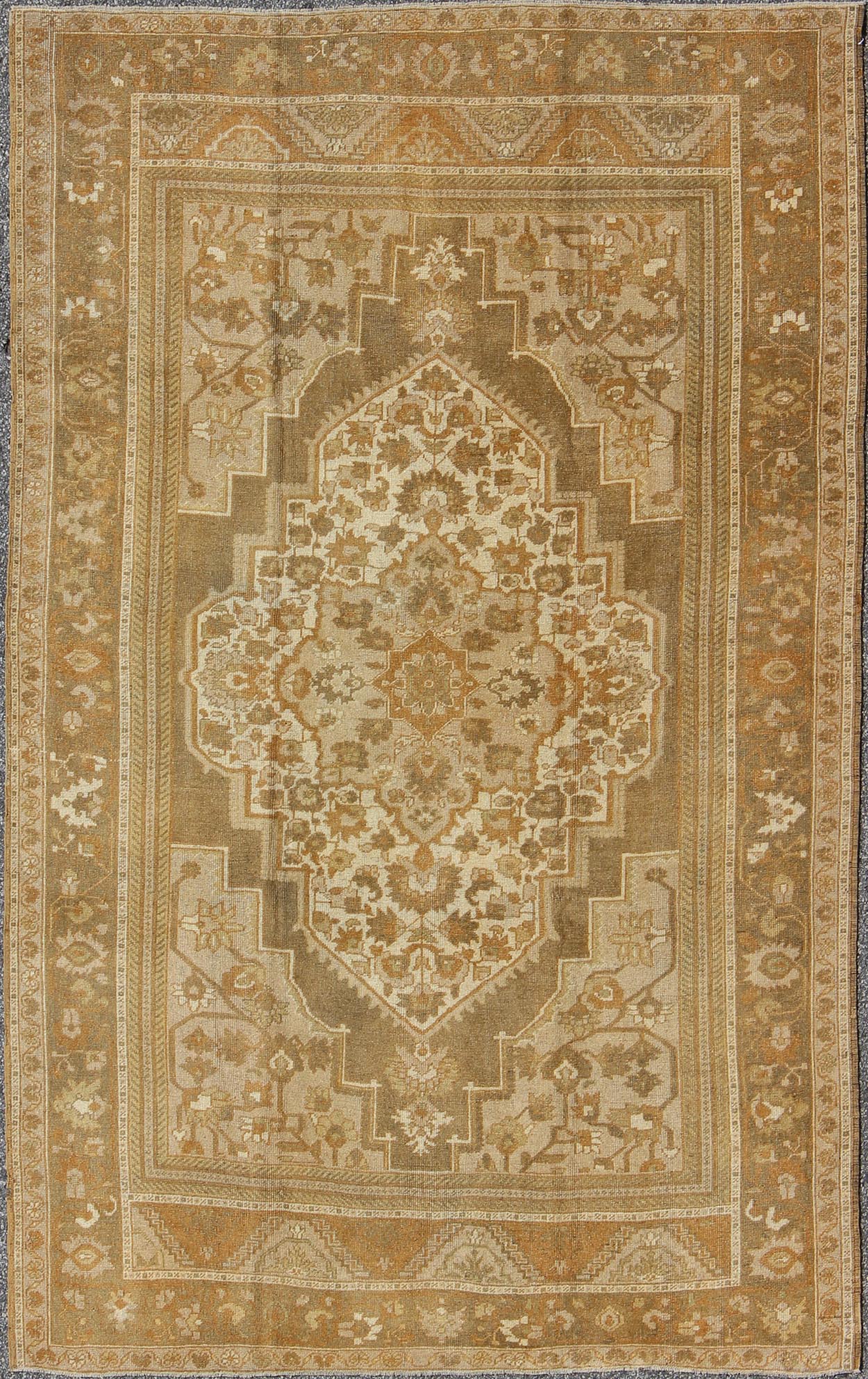 Vintage Turkish Oushak Rug with Ivory, Tan, Light Brown Floral Medallion Design Measures 6'5 x 9'7 This vintage Turkish Oushak carpet, (circa mid - 20th century) features a floral central medallion design, as well as patterns of smaller t... - Keivan Woven ArtsTU - MTU - 136564 - 5008Rug