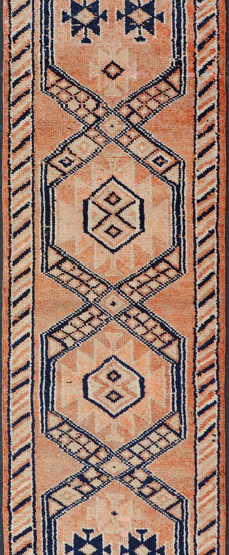 Tribal Medallion Design Vintage Turkish Runner in Orange and Navy Blue Oushak runner with tribal motifs in blue and orange, Keivan Woven Arts / rug TU - MTU - 141, country of origin / type: Turkey / Oushak, circa 1960 Measures: 2'11 x 12 - Keivan Woven ArtsTU - MTU - 141 - 19142Rug