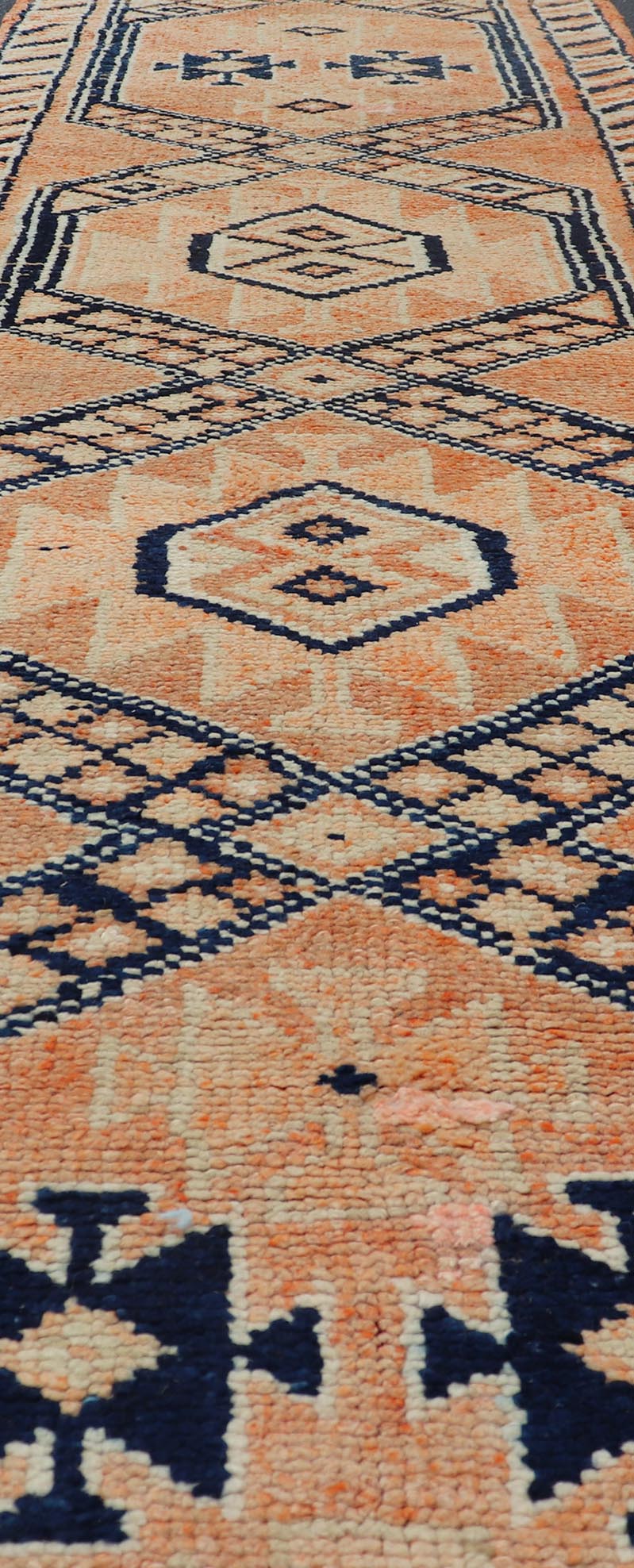 Tribal Medallion Design Vintage Turkish Runner in Orange and Navy Blue Oushak runner with tribal motifs in blue and orange, Keivan Woven Arts / rug TU - MTU - 141, country of origin / type: Turkey / Oushak, circa 1960 Measures: 2'11 x 12 - Keivan Woven ArtsTU - MTU - 141 - 19142Rug