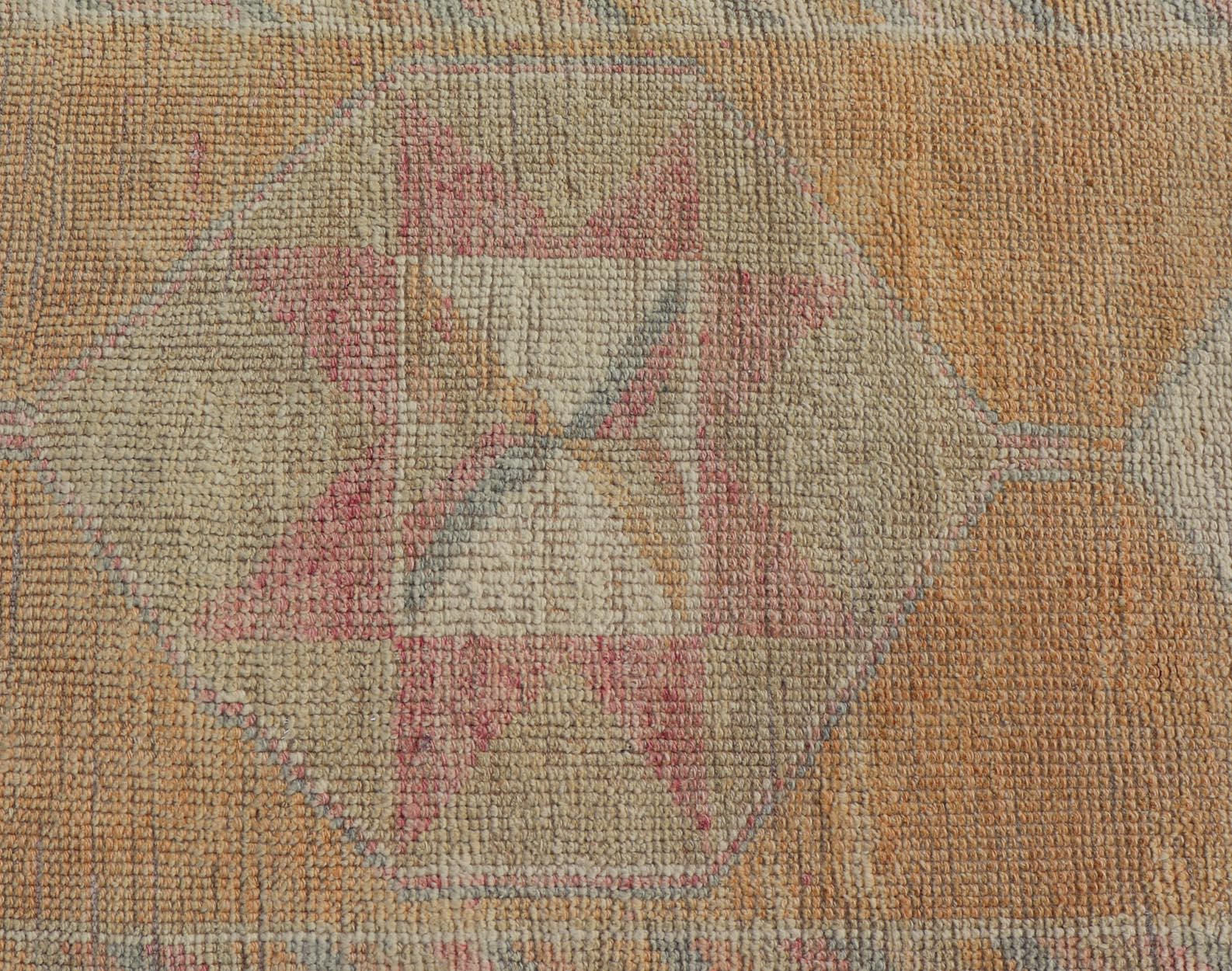 Tribal Medallion Vintage Turkish Oushak Runner in Orange, Blue and Cream Measures: 2'9 x 12'0 This very unique Oushak is uncommon in its design, from the bright and creamy orange background to the angular and sharp medallions center... - Keivan Woven ArtsTU - MTU - 15 - 18728