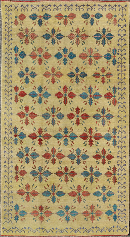 Vintage Turkish Sub - Geometric All - Over Floral Oushak in Yellow, Red, and Blue Measures: 6'5 x 11'5 Set on a pale yellow background, this unique Turkish Oushak rug displays an all - over mid - century modern design. The colors include shades... - Keivan Woven ArtsTU - MTU - 3318 - 5776Rug