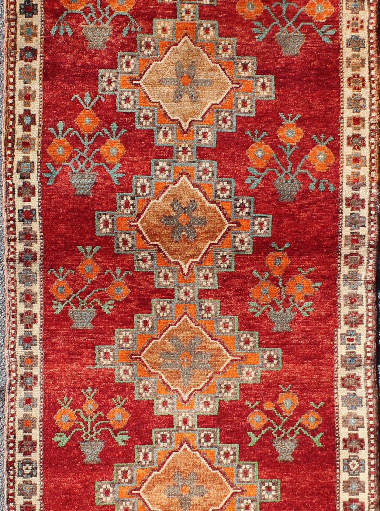 Vintage Turkish Oushak Runner in Beautiful Royal Red, Light Blue/Gray and Orange This vintage Oushak runner features a unique blend of cheerful colors and an intricately beautiful design. The multi - layered diamond medallions are complemented by ... - Keivan Woven ArtsTU - MTU - 3334 - 5802Rug