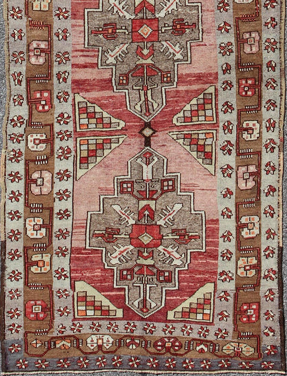 Vintage Turkish Oushak Long Runner with Rose and Pink This vintage Oushak runner contains a unique blend of cheerful colors and an intricately beautiful design. The multi - layered diamond medallions are complemented by a symmetrical set of floral... - Keivan Woven ArtsTU - MTU - 3631 - 6887Rug