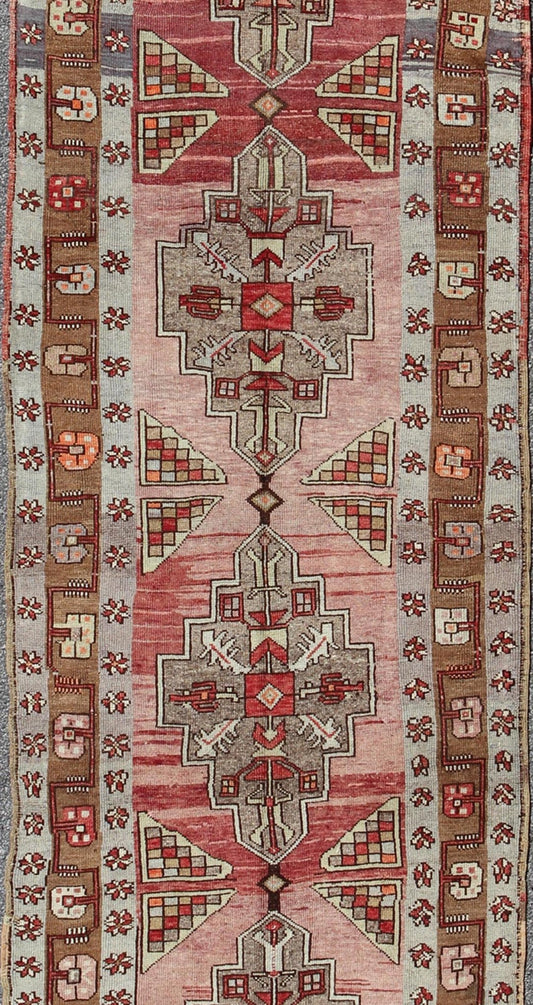 Vintage Turkish Oushak Long Runner with Rose and Pink This vintage Oushak runner contains a unique blend of cheerful colors and an intricately beautiful design. The multi - layered diamond medallions are complemented by a symmetrical set of floral... - Keivan Woven ArtsTU - MTU - 3631 - 6887Rug