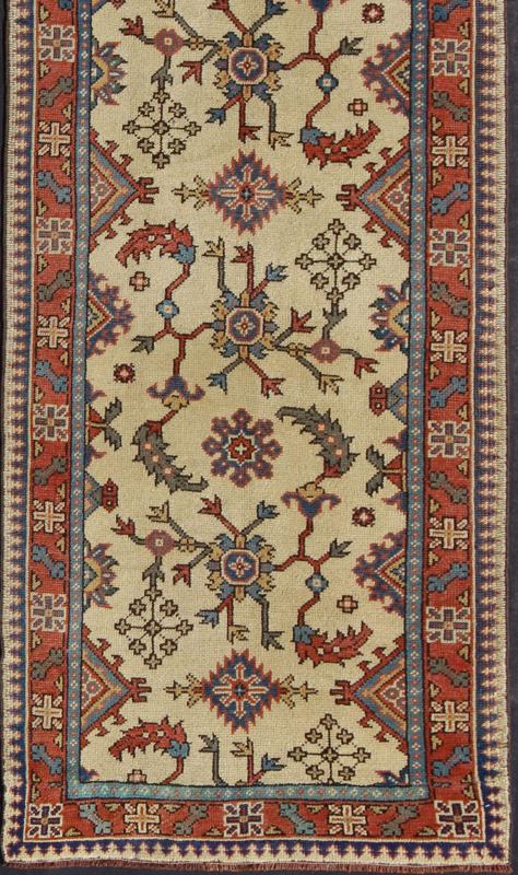 Long Turkish Oushak Runner with All - Over Floral Design in Ivory, Red and Blue, rug mtu - 4627, country of origin / type: Turkey / Oushak, circa mid - 20th century This long antique Turkish Oushak runner (circa 1920) is remarkably elegant in both col... - Keivan Woven ArtsTU - MTU - 4627 - 7739Rug