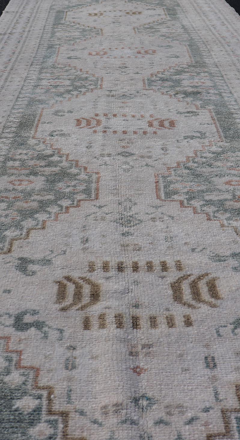 Measures: 3'2 x 9'4 Vintage Turkish Oushak Rug with Central Medallions in Cream and Light Green. Keivan Woven Arts / Rug TU - MTU - 4660, country of origin / type: Turkey / Oushak, circa mid - 20th century. This vintage Turkish Oushak rug (circa mid - 2... - Keivan Woven ArtsTU - MTU - 4660 - 22015Rug