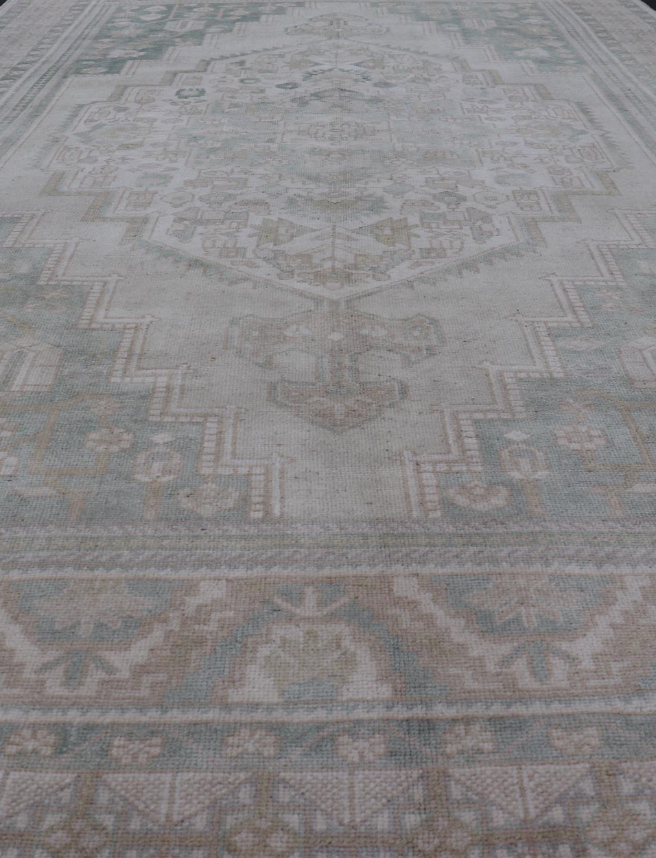 Measures: 6'4 x 11'9 Turkish Vintage Oushak Rug With Medallion in Muted Light Green and Cream. Keivan Woven Arts / rug TU - MTU - 4665 country of origin / type: Turkey / circa 1940 This vintage muted Turkish Oushak Rug has been hand - knotted in ... - Keivan Woven ArtsTU - MTU - 4665 - 22039Rug