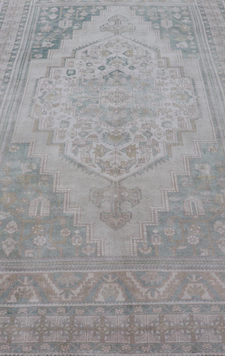 Measures: 6'4 x 11'9 Turkish Vintage Oushak Rug With Medallion in Muted Light Green and Cream. Keivan Woven Arts / rug TU - MTU - 4665 country of origin / type: Turkey / circa 1940 This vintage muted Turkish Oushak Rug has been hand - knotted in ... - Keivan Woven ArtsTU - MTU - 4665 - 22039Rug