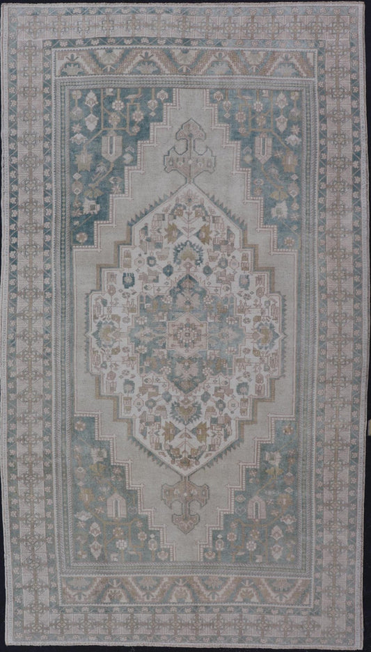 Measures: 6'4 x 11'9 Turkish Vintage Oushak Rug With Medallion in Muted Light Green and Cream. Keivan Woven Arts / rug TU - MTU - 4665 country of origin / type: Turkey / circa 1940 This vintage muted Turkish Oushak Rug has been hand - knotted in ... - Keivan Woven ArtsTU - MTU - 4665 - 22039