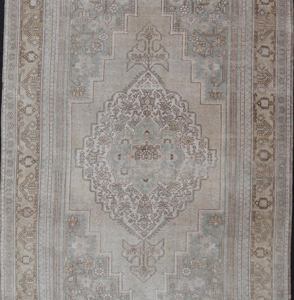 Measures: 6'8 x 12'2 Vintage Turkish Floral Medallion Oushak Rug in Light Brown and Light Blue. Country of origin: Turkey; Type: Oushak; Design: Medallion, Floral Medallion; Keivan Woven Arts: rug / TU - MTU - 4666. mid - 20 - th century. Set on a k... - Keivan Woven ArtsTU - MTU - 4666 - 22045Rug