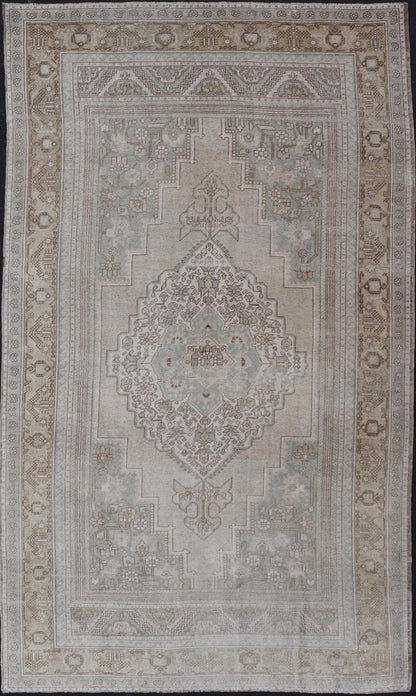 Measures: 6'8 x 12'2 Vintage Turkish Floral Medallion Oushak Rug in Light Brown and Light Blue. Country of origin: Turkey; Type: Oushak; Design: Medallion, Floral Medallion; Keivan Woven Arts: rug / TU - MTU - 4666. mid - 20 - th century. Set on a k... - Keivan Woven ArtsTU - MTU - 4666 - 22045Rug