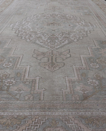 Measures: 6'8 x 12'2 Vintage Turkish Floral Medallion Oushak Rug in Light Brown and Light Blue. Country of origin: Turkey; Type: Oushak; Design: Medallion, Floral Medallion; Keivan Woven Arts: rug / TU - MTU - 4666. mid - 20 - th century. Set on a k... - Keivan Woven ArtsTU - MTU - 4666 - 22045Rug