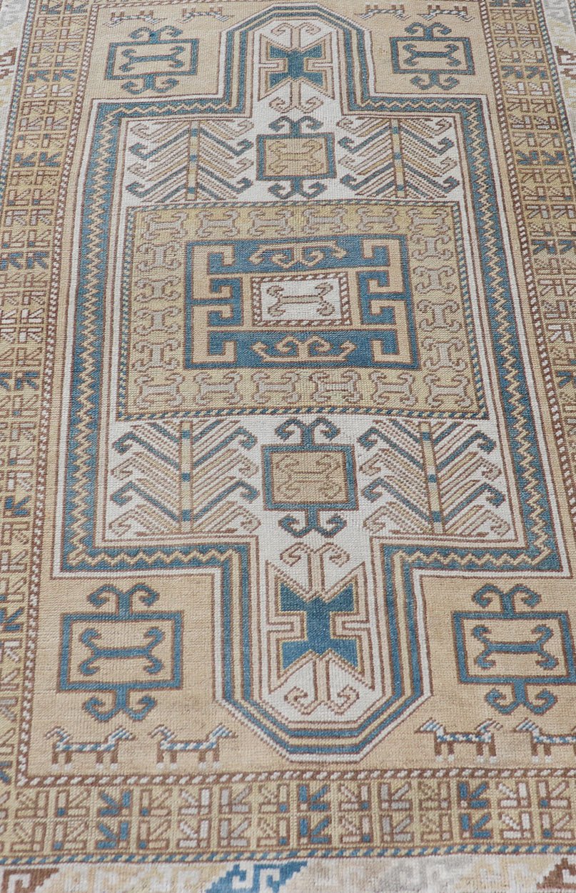 Measures: 3'5 x 5'8 Vintage Turkish Medallion Oushak Rug in Blue, Mocha, and Taupe. Country of Origin: Turkey; Type: Oushak; Design: Medallion, Tribal Medallion, Floral Medallion; Keivan Woven Arts: rug TU - MTU - 4670. Unique in its color palette ... - Keivan Woven ArtsTU - MTU - 4670 - 22902Rug