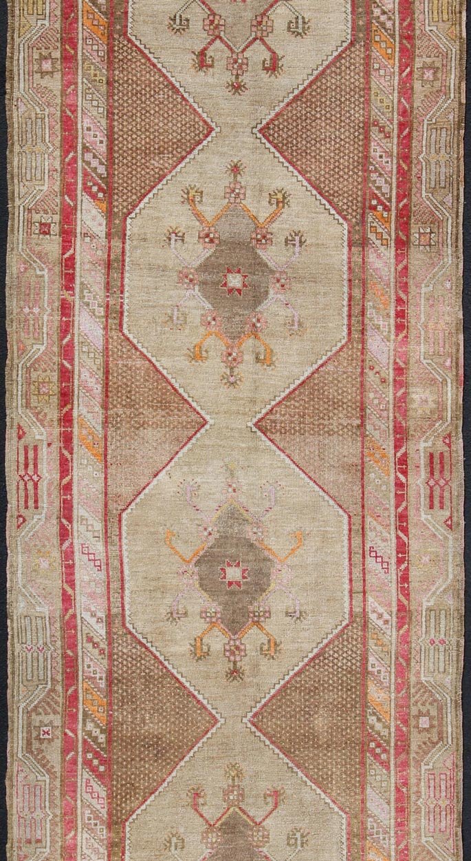 Turkish Oushak Gallery Rug with Multi - Medallion Design in Earth Tones and Red accent. Vintage Oushak Carpet with Tribal Medallion Design, rug TU - MTU - 4820, country of origin / type: Turkey / Oushak, circa 1940 This vintage Oushak carpet fr... - Keivan Woven ArtsTU - MTU - 4820 - 10768Rug
