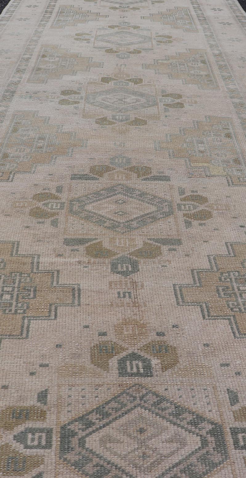 Vintage Turkish Oushak Runner in Neutral Tones , Taupe, Gray Green, Yellow. Vintage Turkish Oushak Runner in Neutral & Warm Colors with Tribal Medallions, rug TU - MTU - 4870, country of origin / type: Turkey / Oushak, circa mid - 20th. Measur... - Keivan Woven ArtsTU - MTU - 4870 - 18619Rug