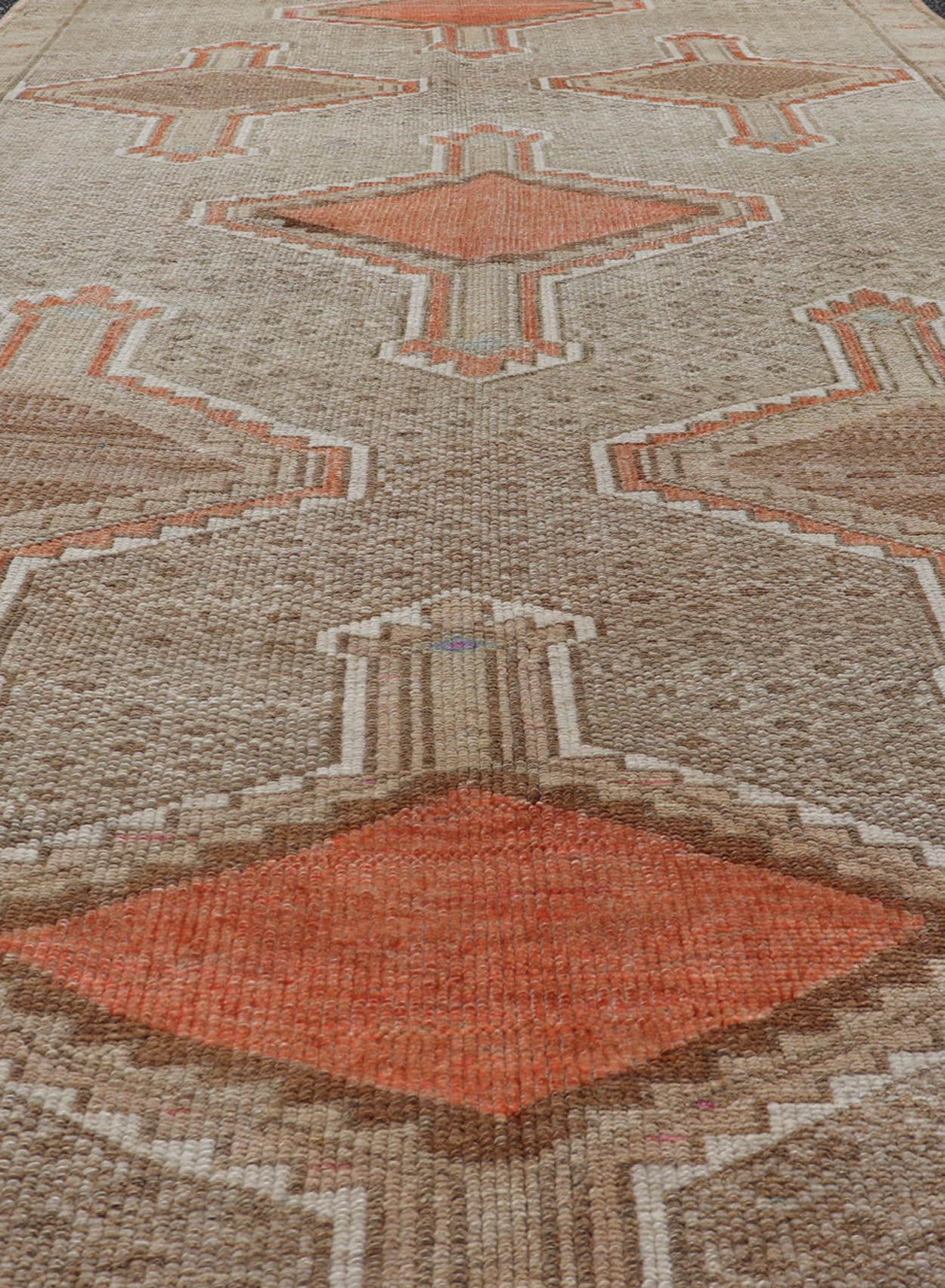Unique & Colorful Turkish Kars Runner with Tribal Designs and Geometric Motifs Vintage Turkish runner in tan background, accent colors, orange, tan, ivory, pink, taupe, Keivan Woven Arts / rug/TU - MTU - 4879, country of origin / type: Turkey / Oush... - Keivan Woven ArtsTU - MTU - 4879 - 18962Rug