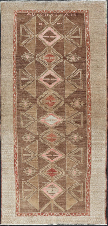 Hand Knotted Colorful Turkish Kars with Tribal Designs and Geometric Motifs Vintage Turkish in Brown background and taupe border with accent colors, red, pink, tan, green, taupe. Keivan Woven Arts / rug /TU - MTU - 4880, country of origin / type: Tu... - Keivan Woven ArtsTU - MTU - 4880 - 18968Rug
