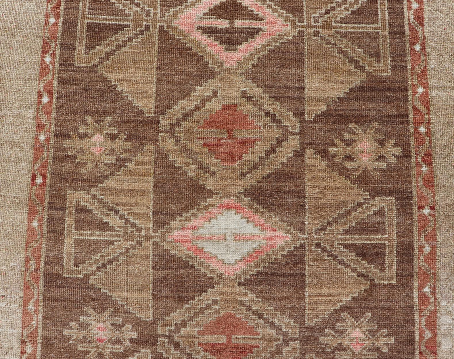 Hand Knotted Colorful Turkish Kars with Tribal Designs and Geometric Motifs Vintage Turkish in Brown background and taupe border with accent colors, red, pink, tan, green, taupe. Keivan Woven Arts / rug /TU - MTU - 4880, country of origin / type: Tu... - Keivan Woven ArtsTU - MTU - 4880 - 18968Rug