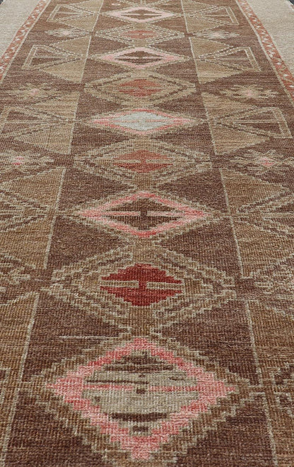 Hand Knotted Colorful Turkish Kars with Tribal Designs and Geometric Motifs Vintage Turkish in Brown background and taupe border with accent colors, red, pink, tan, green, taupe. Keivan Woven Arts / rug /TU - MTU - 4880, country of origin / type: Tu... - Keivan Woven ArtsTU - MTU - 4880 - 18968Rug