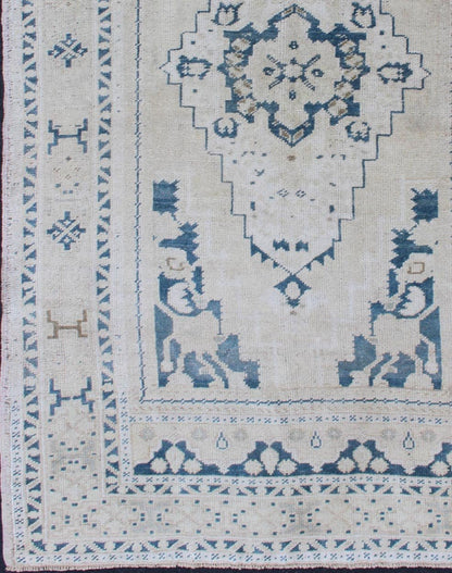 Vintage Hand Knotted Turkish Oushak Rug With Central Medallion in Blue and Cream Faded vintage Turkish Oushak rug with Central Medallion in cream and blue, rug TU - MTU - 4901, Keivan Woven Arts country of origin / type: Turkey / Oushak, circa 1940 ... - Keivan Woven ArtsTU - MTU - 4901 - 11847Rug