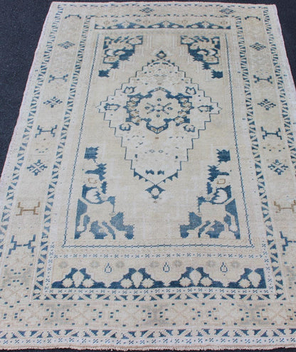 Vintage Hand Knotted Turkish Oushak Rug With Central Medallion in Blue and Cream Faded vintage Turkish Oushak rug with Central Medallion in cream and blue, rug TU - MTU - 4901, Keivan Woven Arts country of origin / type: Turkey / Oushak, circa 1940 ... - Keivan Woven ArtsTU - MTU - 4901 - 11847Rug