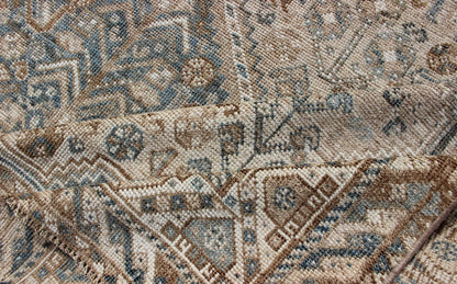 Blue/Taupe/ an Antique Persian Shiraz Rug with Tribal Geometric Medallions Persian Shiraz rug with Vertical Sub - Geometric Medallions, rug DSP - A342934, country of origin / type: Iran / Shiraz, circa 1920 Persian Shiraz rug with Vertical Sub - ... - Keivan Woven ArtsTU - MTU - 4904 - 12144Rug