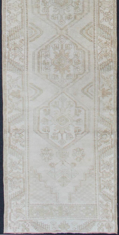 Subdued Vintage Hand Knotted Turkish Oushak Runner With Medallions in Soft Cream Lightly toned vintage Turkish Runner with Oushak design, Keivan Woven Arts / rug TU - MTU - 4909, country of origin / type: Turkey / Oushak, circa 1940. This vin... - Keivan Woven ArtsTU - MTU - 4909 - 12148Rug