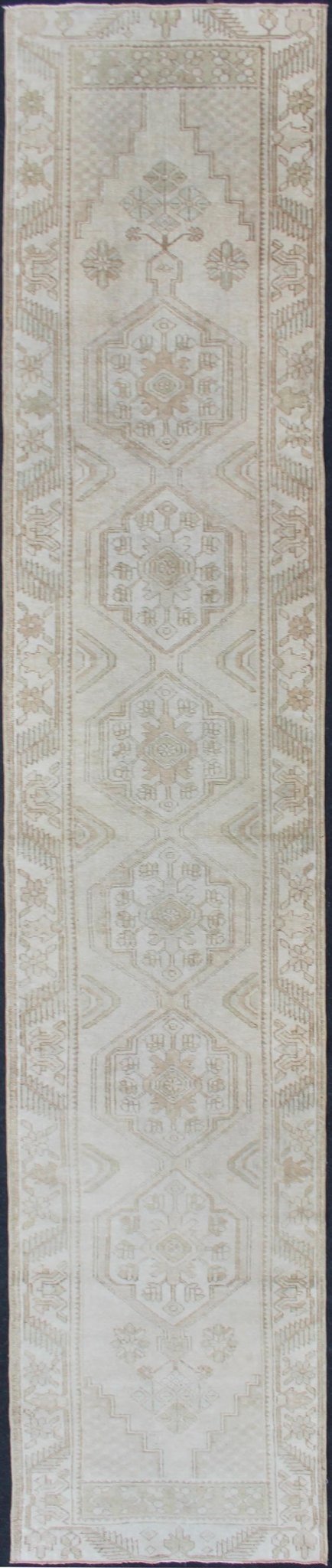 Subdued Vintage Hand Knotted Turkish Oushak Runner With Medallions in Soft Cream Lightly toned vintage Turkish Runner with Oushak design, Keivan Woven Arts / rug TU - MTU - 4909, country of origin / type: Turkey / Oushak, circa 1940. This vin... - Keivan Woven ArtsTU - MTU - 4909 - 12148Rug