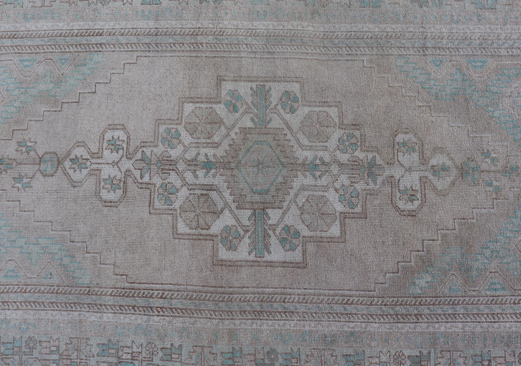 Vintage Turkish Medallion Oushak Area Rug in Tan, Taupe, Pink, and Green Measures: 4'7 x 8'4 This vintage beauty was hand - knotted in Turkey during the 1950's. Vintage Oushak rugs are incredibly popular for their durability, as well as t... - Keivan Woven ArtsTU - MTU - 4949 - 19208Rug