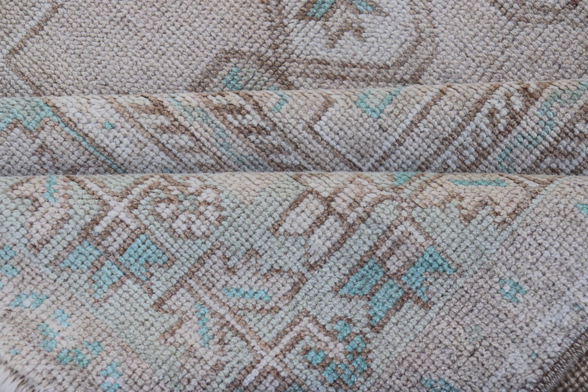 Vintage Turkish Medallion Oushak Area Rug in Tan, Taupe, Pink, and Green Measures: 4'7 x 8'4 This vintage beauty was hand - knotted in Turkey during the 1950's. Vintage Oushak rugs are incredibly popular for their durability, as well as t... - Keivan Woven ArtsTU - MTU - 4949 - 19208Rug