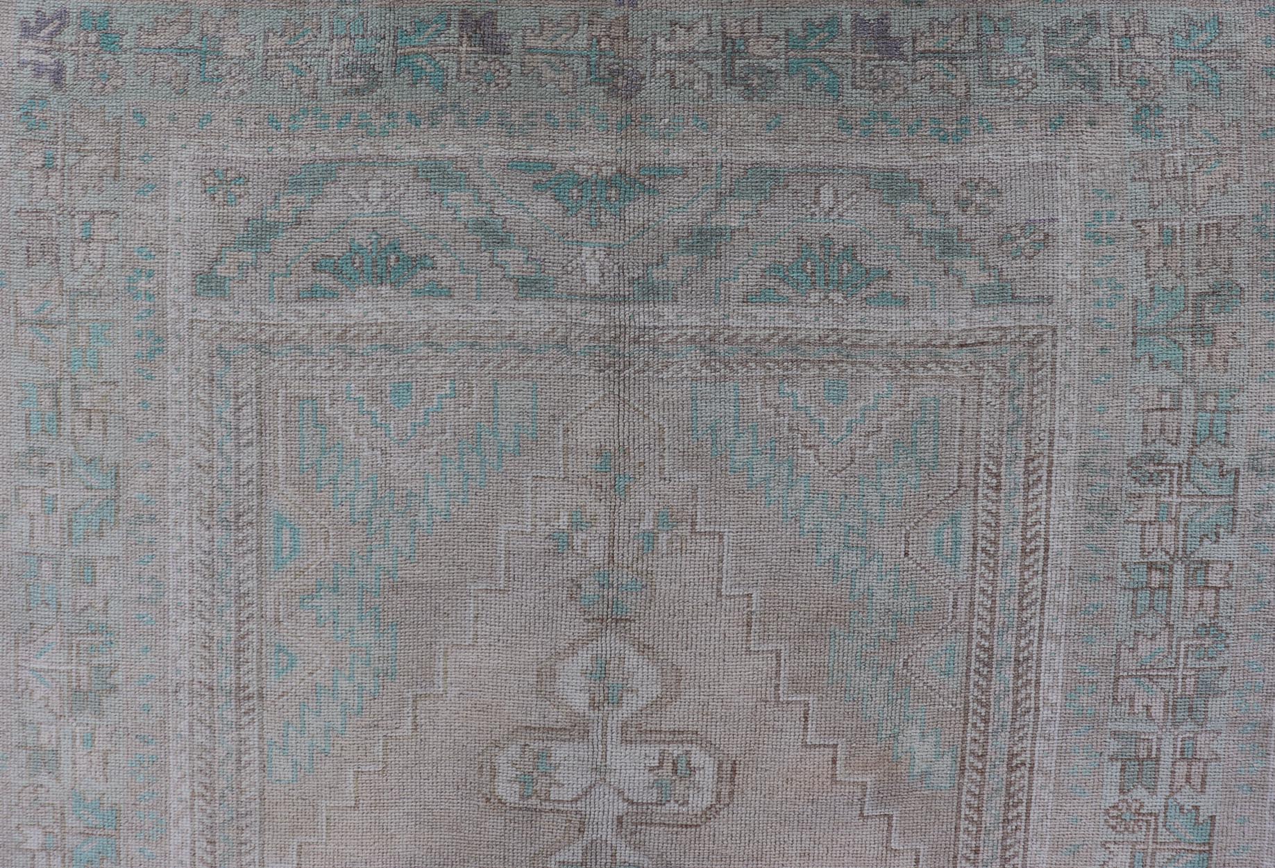 Vintage Turkish Medallion Oushak Area Rug in Tan, Taupe, Pink, and Green Measures: 4'7 x 8'4 This vintage beauty was hand - knotted in Turkey during the 1950's. Vintage Oushak rugs are incredibly popular for their durability, as well as t... - Keivan Woven ArtsTU - MTU - 4949 - 19208Rug