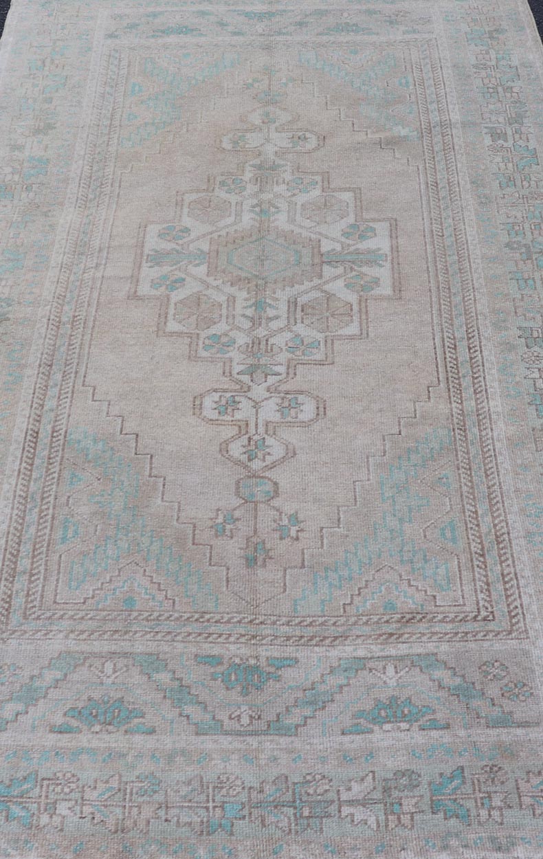 Vintage Turkish Medallion Oushak Area Rug in Tan, Taupe, Pink, and Green Measures: 4'7 x 8'4 This vintage beauty was hand - knotted in Turkey during the 1950's. Vintage Oushak rugs are incredibly popular for their durability, as well as t... - Keivan Woven ArtsTU - MTU - 4949 - 19208Rug