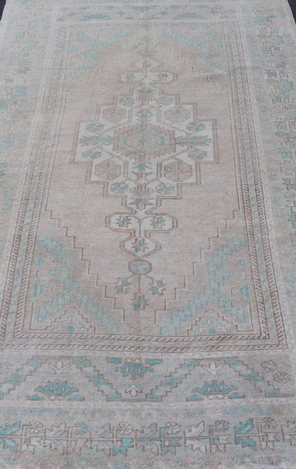 Vintage Turkish Medallion Oushak Area Rug in Tan, Taupe, Pink, and Green Measures: 4'7 x 8'4 This vintage beauty was hand - knotted in Turkey during the 1950's. Vintage Oushak rugs are incredibly popular for their durability, as well as t... - Keivan Woven ArtsTU - MTU - 4949 - 19208Rug