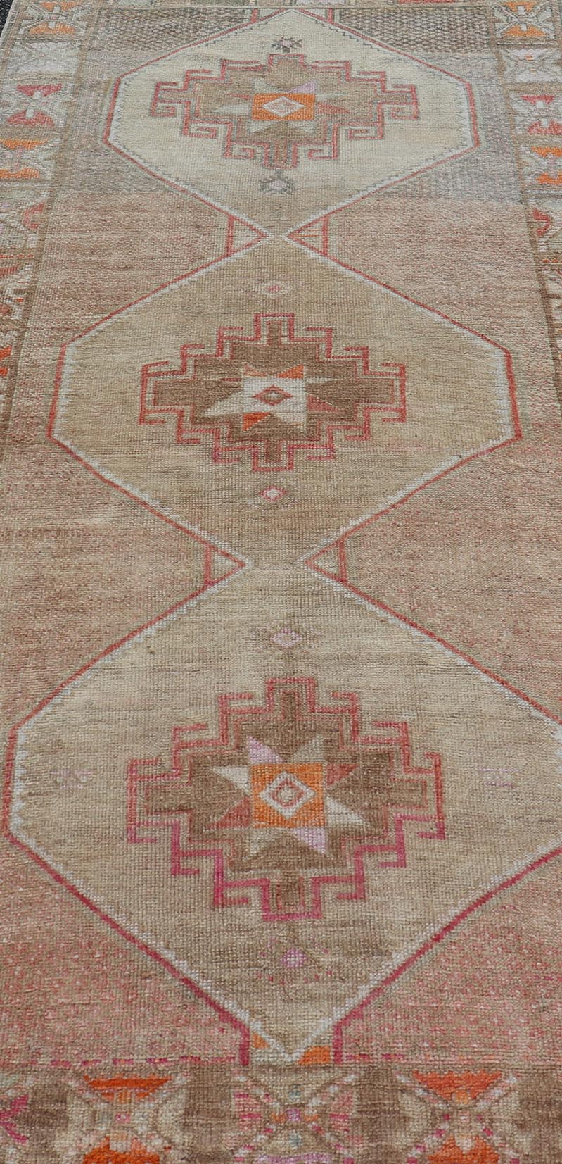 Vintage wide Gallery runner from Turkey with Medallion design in various tones of tan, taupe, orange, red, and browns. Keivan Woven Arts rug TU - MTU - 4955, country of origin / type: Turkey / Kars, circa 1940 Vintage Turkish Kars Runner in Brown Co... - Keivan Woven ArtsTU - MTU - 4955 - 19004Rug