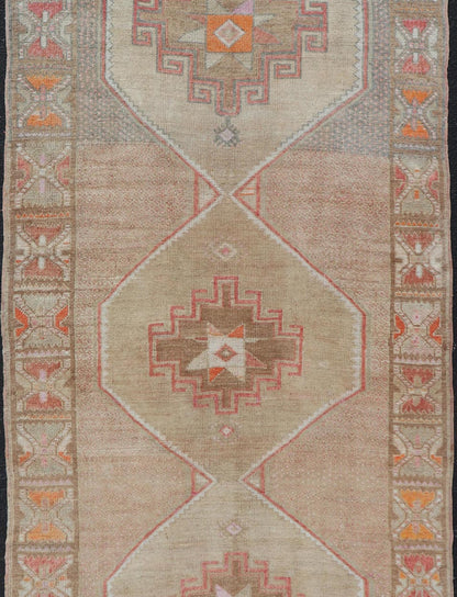 Vintage wide Gallery runner from Turkey with Medallion design in various tones of tan, taupe, orange, red, and browns. Keivan Woven Arts rug TU - MTU - 4955, country of origin / type: Turkey / Kars, circa 1940 Vintage Turkish Kars Runner in Brown Co... - Keivan Woven ArtsTU - MTU - 4955 - 19004Rug