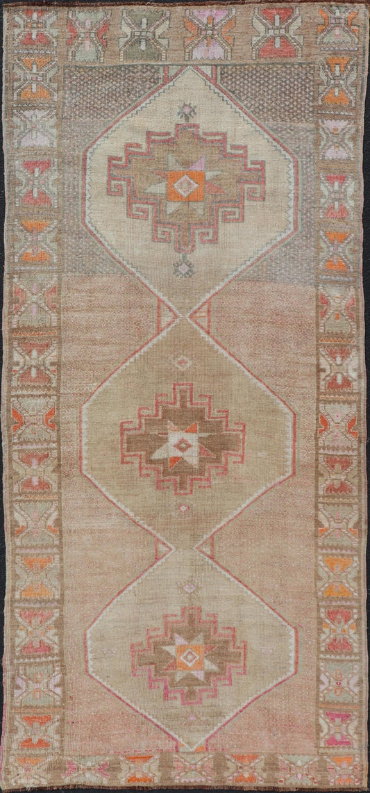 Vintage wide Gallery runner from Turkey with Medallion design in various tones of tan, taupe, orange, red, and browns. Keivan Woven Arts rug TU - MTU - 4955, country of origin / type: Turkey / Kars, circa 1940 Vintage Turkish Kars Runner in Brown Co... - Keivan Woven ArtsTU - MTU - 4955 - 19004Rug